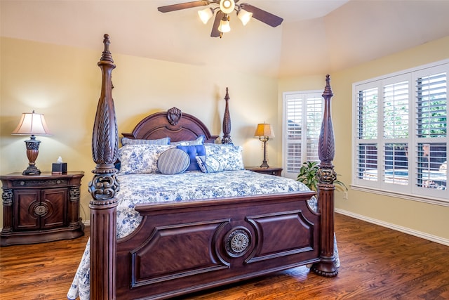 bedroom with vaulted ceiling, ceiling fan, and dark hardwood / wood-style flooring