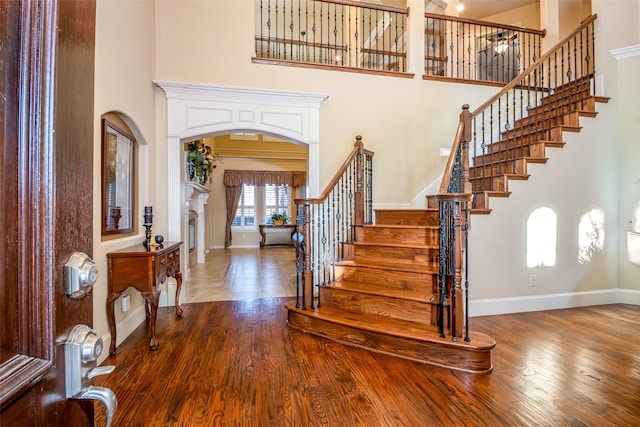 entrance foyer featuring a high ceiling and hardwood / wood-style flooring