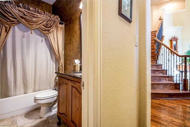 full bathroom with vanity, toilet, and shower / bath combo