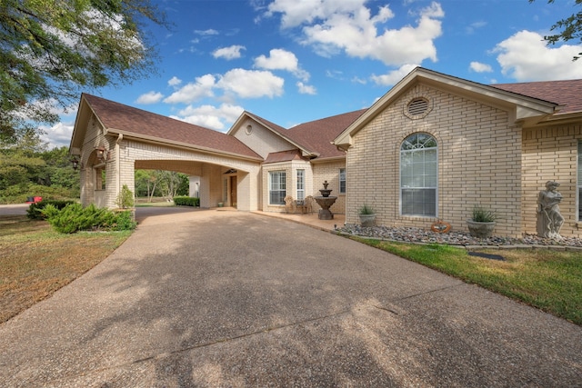 view of front of home featuring a carport