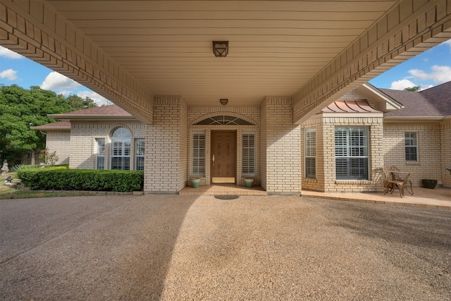 doorway to property with a patio