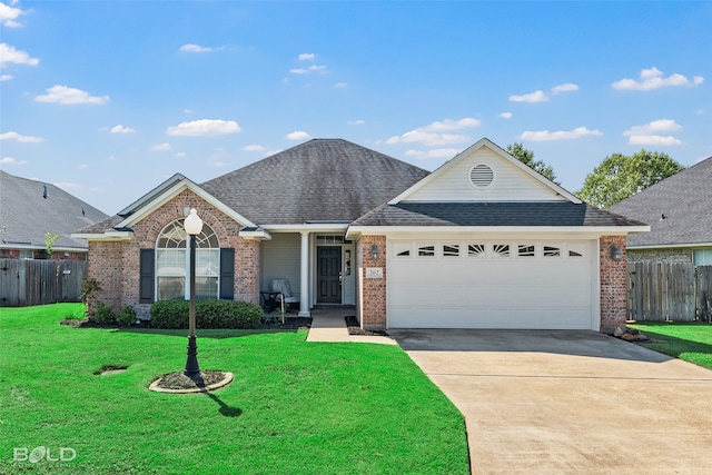 ranch-style house featuring a garage and a front yard