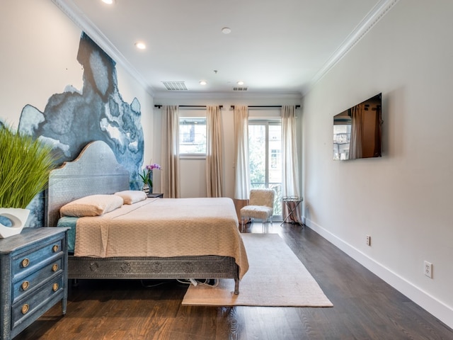 bedroom featuring dark hardwood / wood-style floors and crown molding