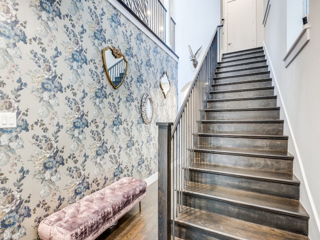 stairs with hardwood / wood-style flooring