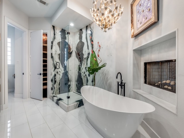 bathroom featuring shower with separate bathtub and tile patterned flooring