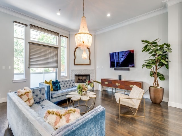 living room featuring plenty of natural light, dark wood-type flooring, and a tile fireplace