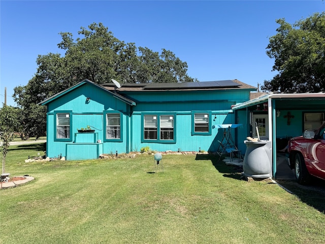 view of front of house with solar panels and a front yard