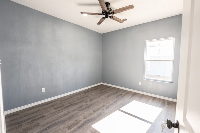 unfurnished room with ceiling fan and hardwood / wood-style flooring