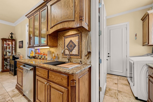 kitchen featuring decorative backsplash, light stone counters, dishwasher, ornamental molding, and sink