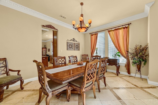 tiled dining area with crown molding and an inviting chandelier