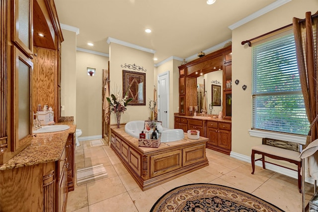 bathroom with vanity, a bath, ornamental molding, toilet, and tile patterned floors