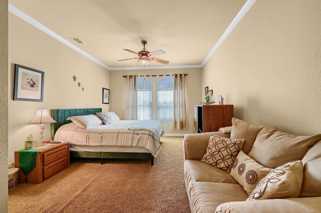 carpeted bedroom featuring ornamental molding and ceiling fan