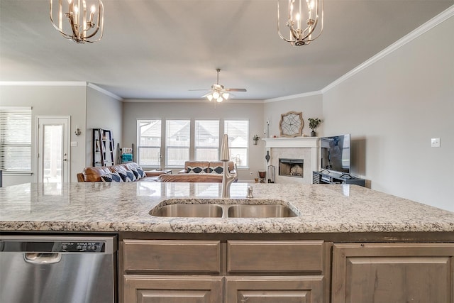 kitchen with hanging light fixtures, sink, stainless steel dishwasher, ceiling fan with notable chandelier, and crown molding