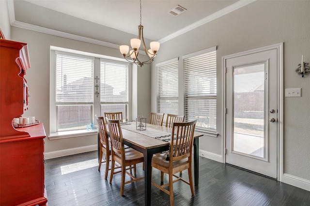 dining room with an inviting chandelier, plenty of natural light, and dark wood-type flooring