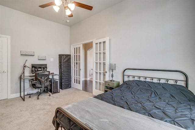 carpeted bedroom featuring french doors and ceiling fan