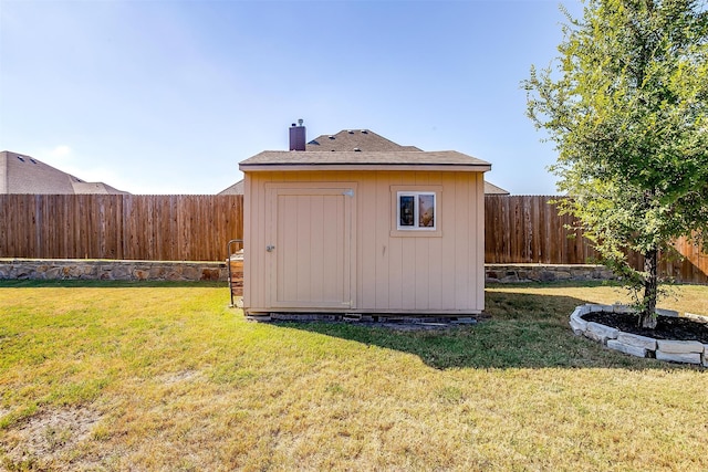 view of outdoor structure with a lawn