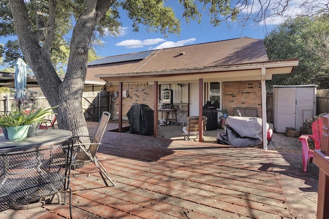 wooden deck featuring grilling area