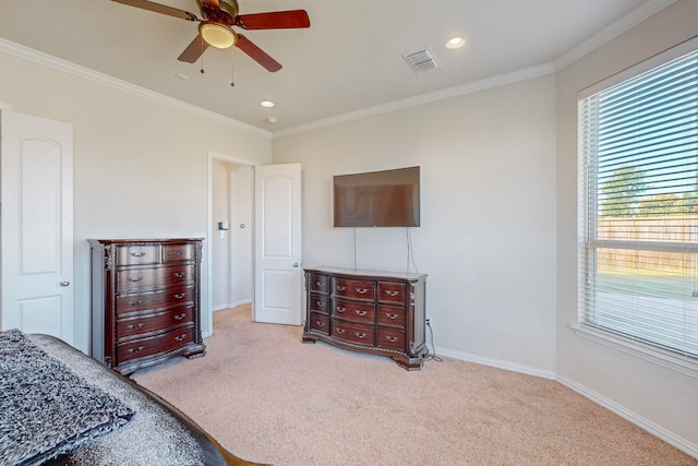 carpeted bedroom with ceiling fan and ornamental molding