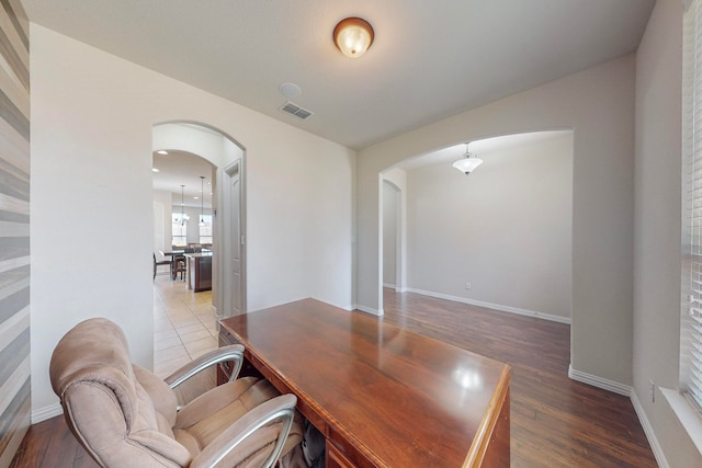 office space with hardwood / wood-style flooring