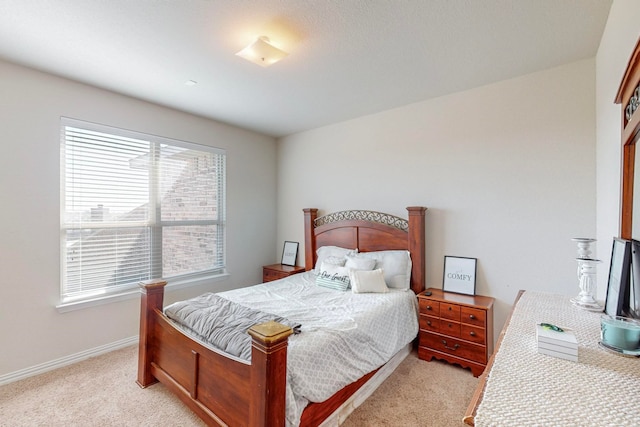 bedroom featuring light colored carpet