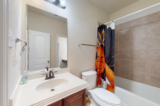 full bathroom featuring toilet, vanity, and shower / tub combo