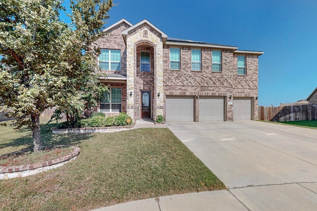 view of front of home featuring a front lawn and a garage