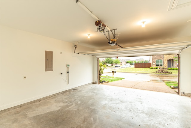 garage featuring a garage door opener and electric panel