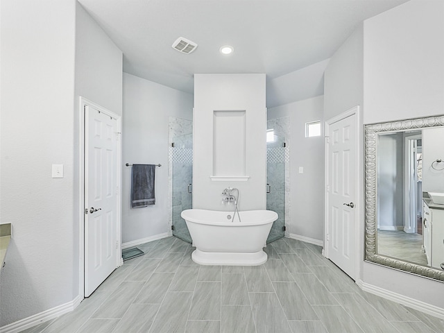 bathroom featuring vanity and separate shower and tub