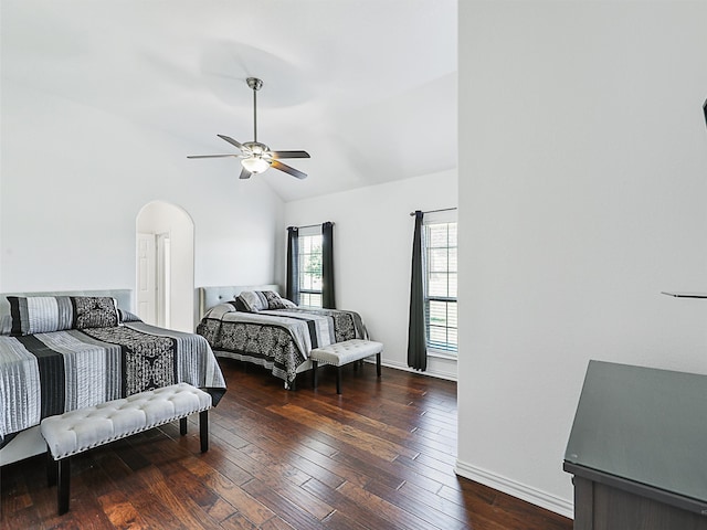 bedroom featuring ceiling fan, vaulted ceiling, and dark wood-type flooring