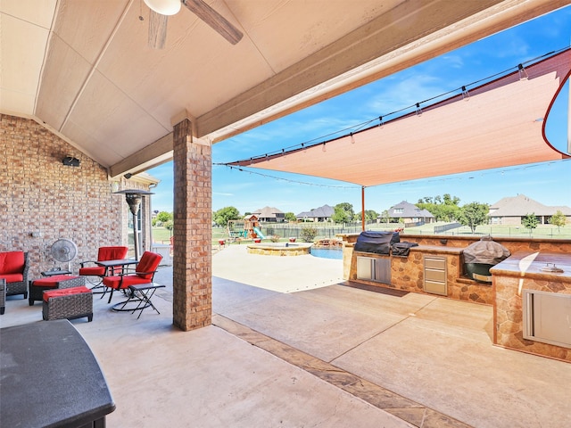 view of patio / terrace featuring outdoor lounge area, area for grilling, and an outdoor kitchen