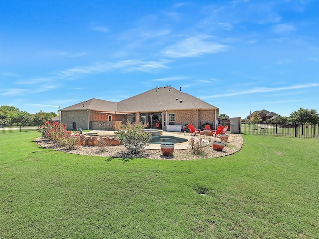 back of property with a patio and a yard