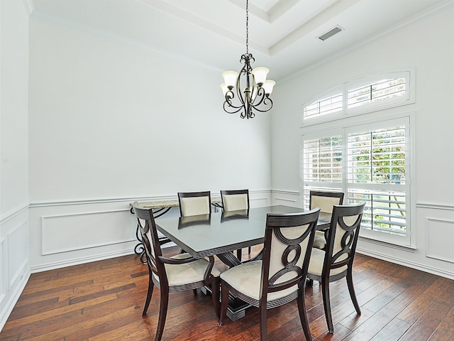 dining area with an inviting chandelier, crown molding, and dark hardwood / wood-style floors