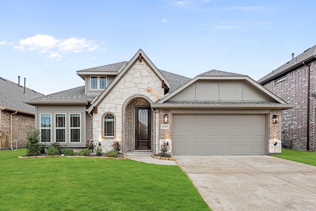 view of front facade with a front lawn and a garage