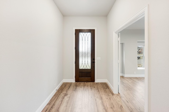 foyer entrance with light hardwood / wood-style floors