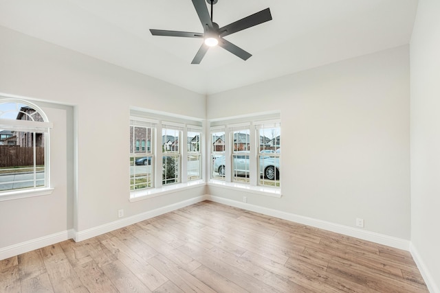 unfurnished room with ceiling fan and light hardwood / wood-style floors