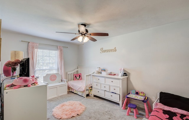 carpeted bedroom with ceiling fan