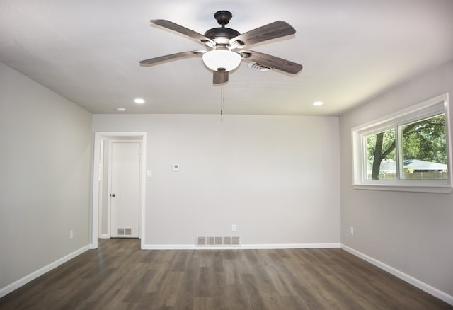 unfurnished room with ceiling fan and dark hardwood / wood-style floors