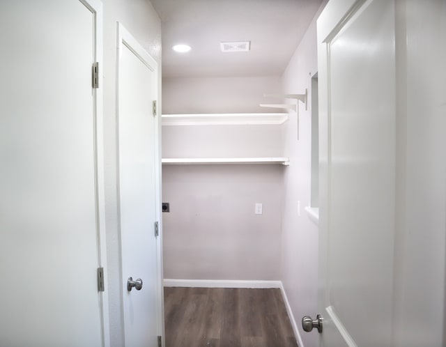 interior space with hardwood / wood-style floors and electric dryer hookup