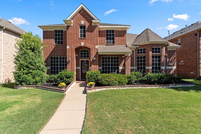 front facade with a front yard