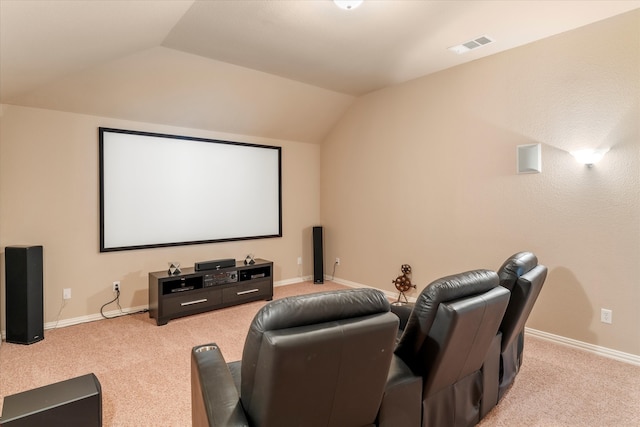 carpeted cinema room with lofted ceiling