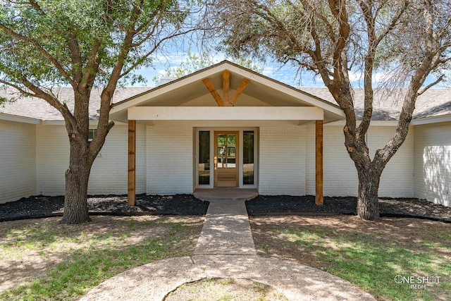 doorway to property with a porch