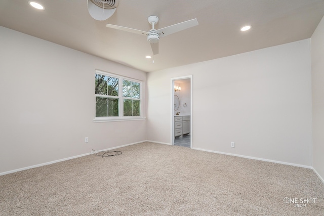 empty room featuring ceiling fan and carpet flooring