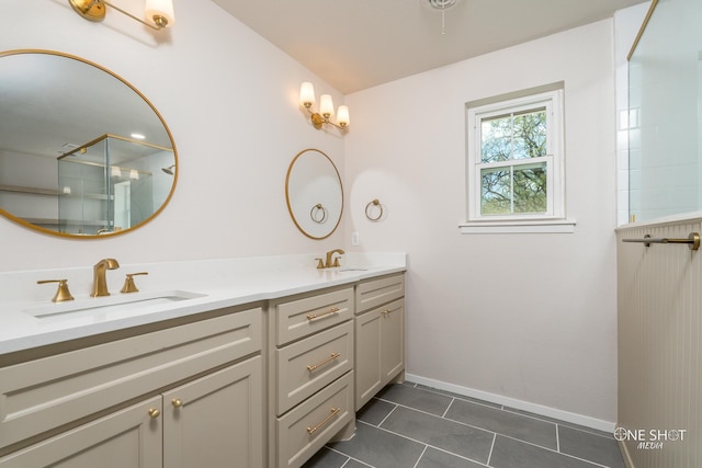 bathroom with tile patterned flooring, an enclosed shower, and vanity