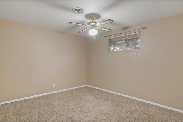 empty room with carpet and ceiling fan