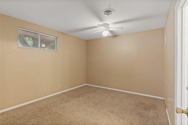 empty room with ceiling fan and carpet floors