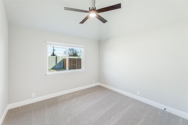 carpeted empty room with lofted ceiling and ceiling fan