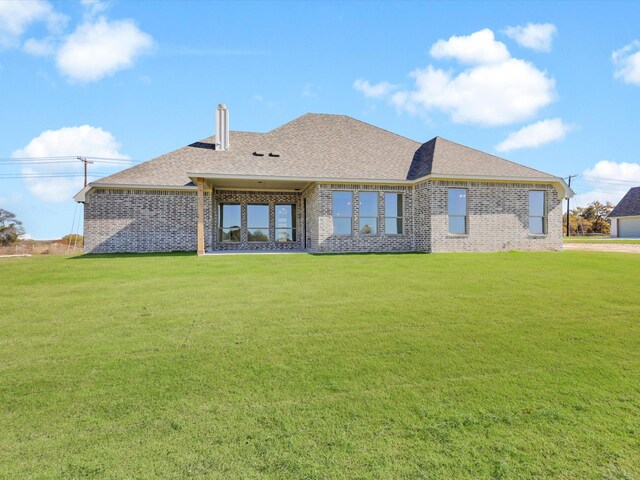 9459 Zion Hill Rd, Poolville, TX 76487 - back of house with a yard, brick siding, and roof with shingles