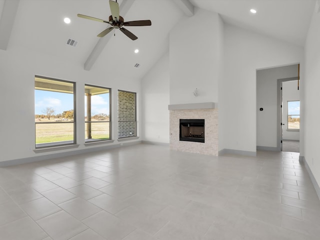 unfurnished living room with beamed ceiling, light tile patterned floors, high vaulted ceiling, and ceiling fan