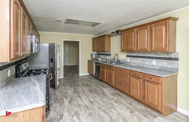 kitchen with light wood-type flooring, sink, stainless steel appliances, backsplash, and ornamental molding