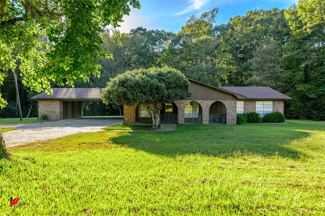 ranch-style home with a front yard